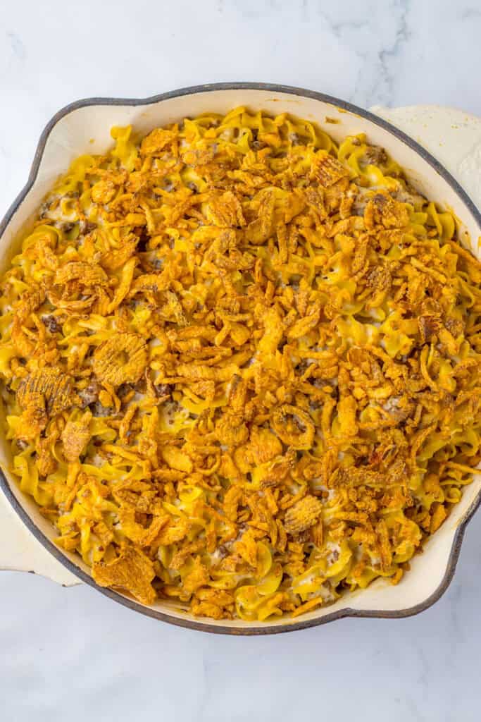 french onion and beef casserole in pot topped with crunchy fried onions