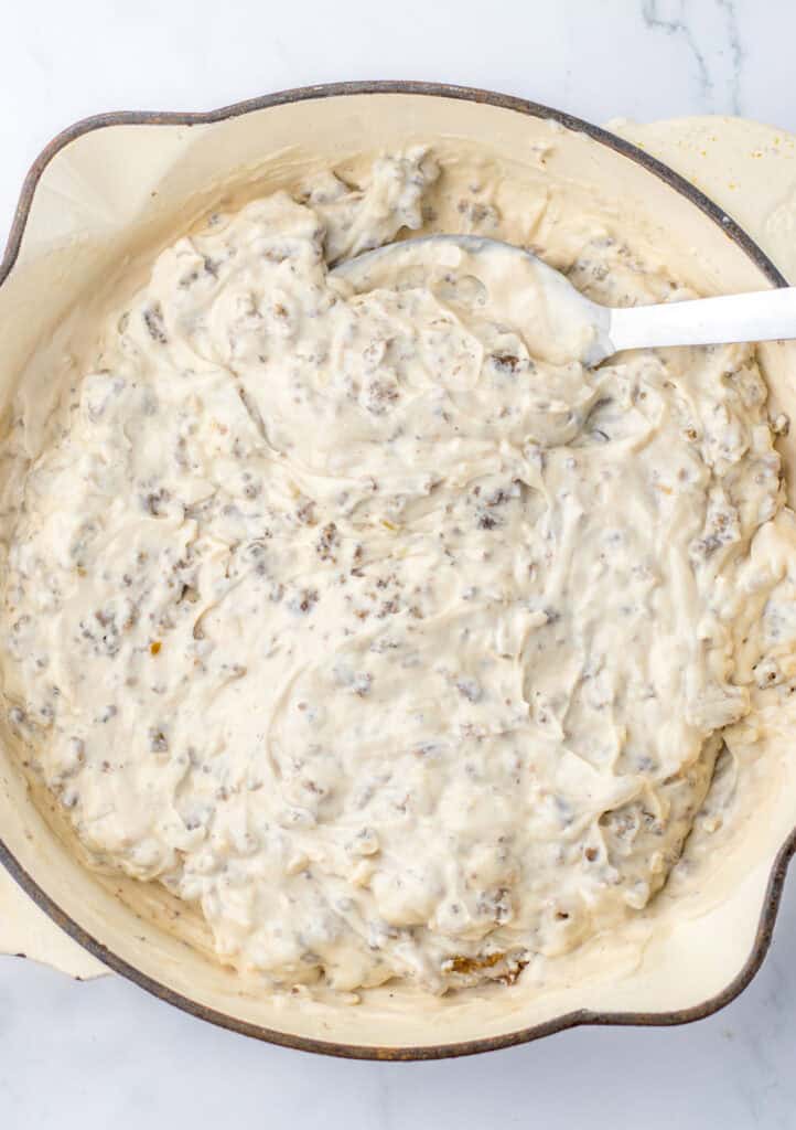 mixing ground beef with sour cream and cream of mushroom soup