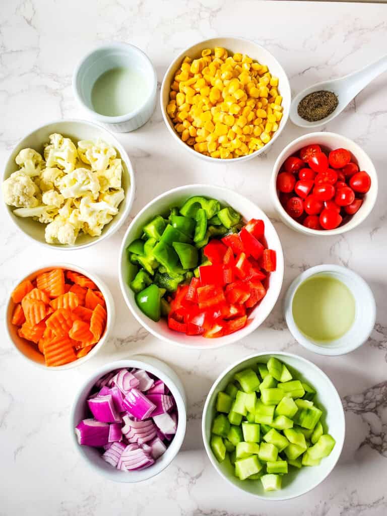 chopped colorful vegetables in bowls
