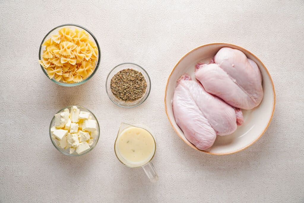 slow cooker chicken casserole ingredients in bowls on counter