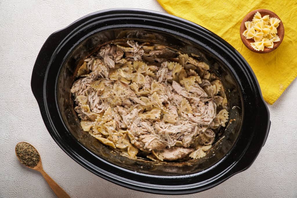 slow cooker with chicken casserole in it