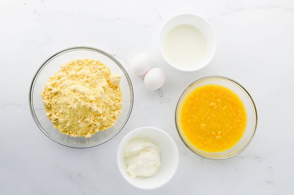cornbread muffin ingredients in bowls on counter