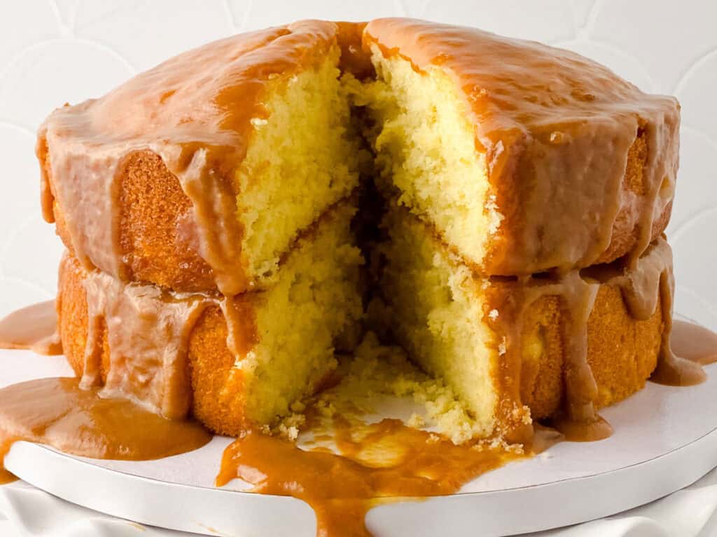 caramel poke cake with slice removed