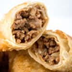 close up of cheeseburger eggroll cut in half