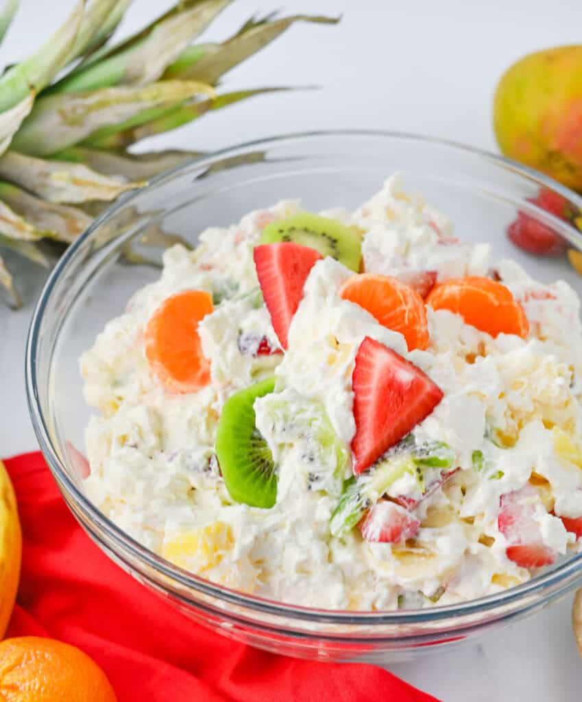Hawaiian cheesecake salad surrounded by fruit