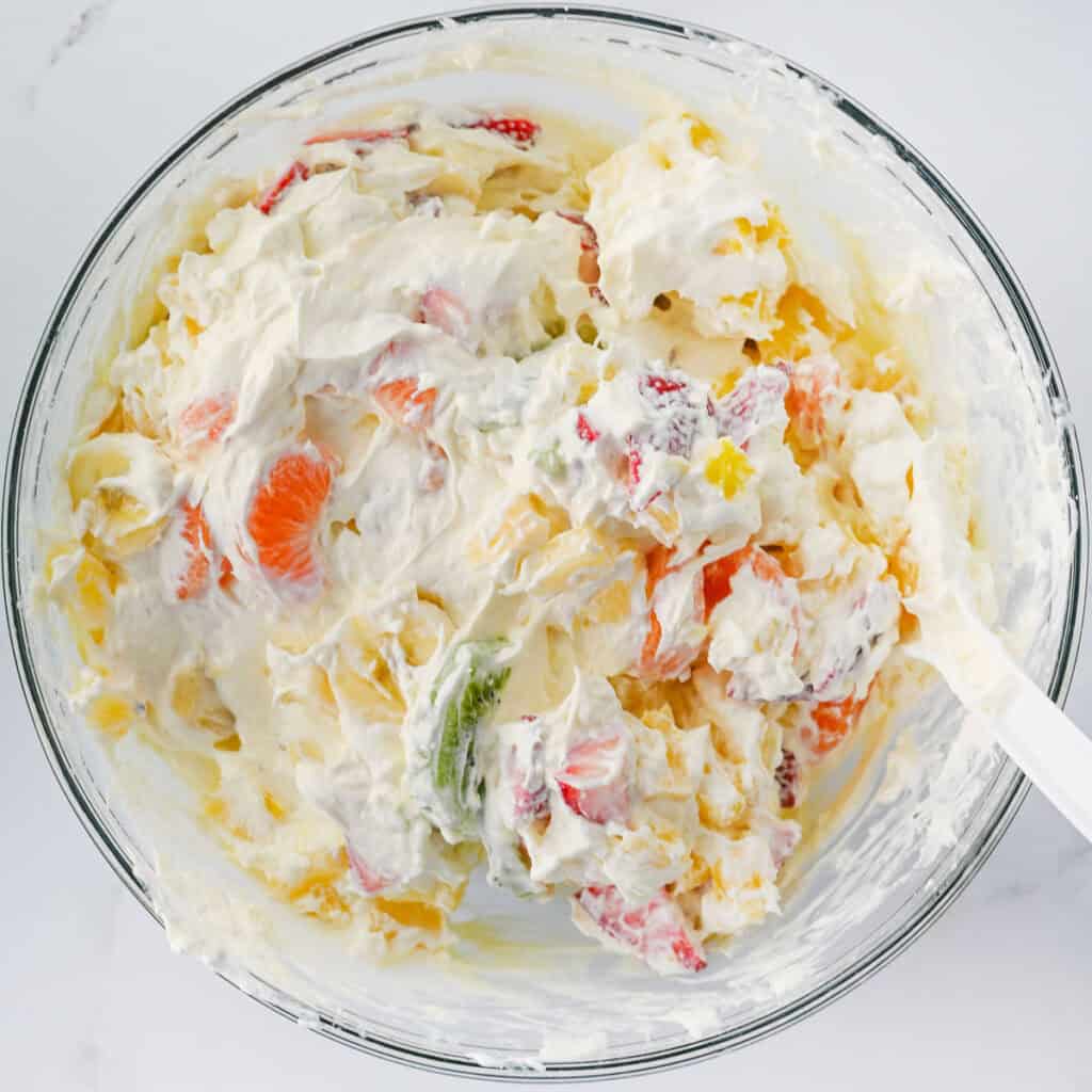 mixing Hawaiian cheesecake salad