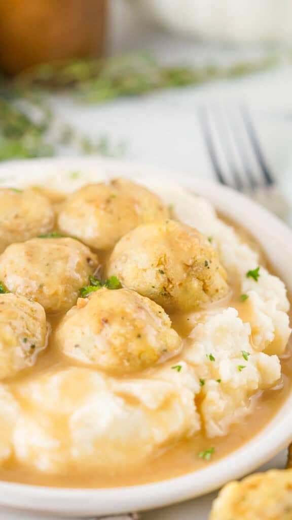 turkey meatballs on mashed potatoes covered in gravy