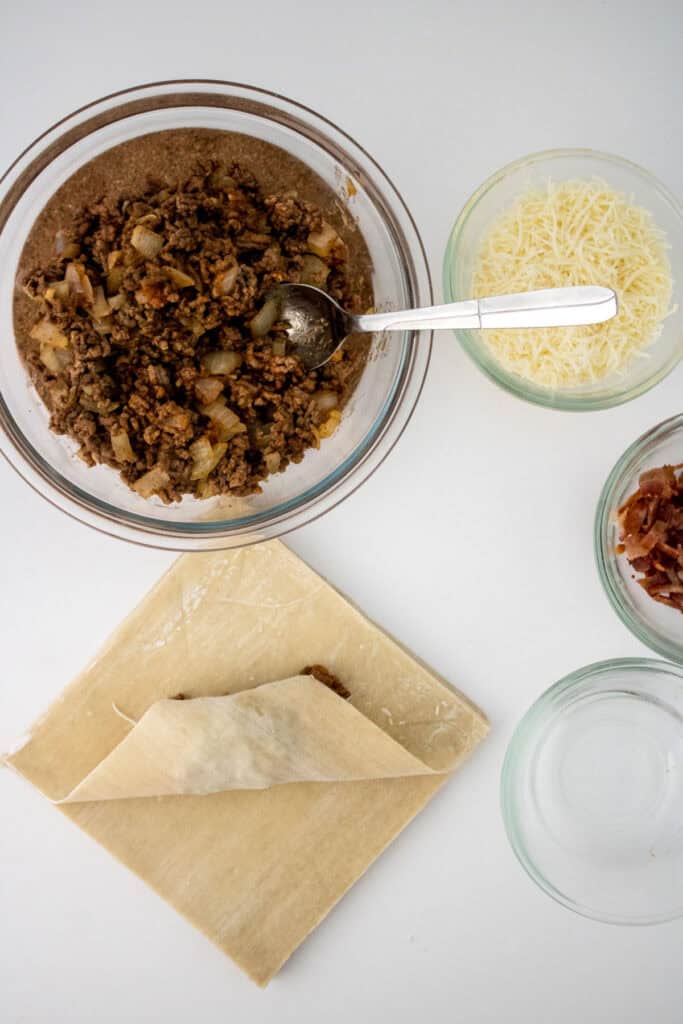 assembling cheeseburger eggrolls