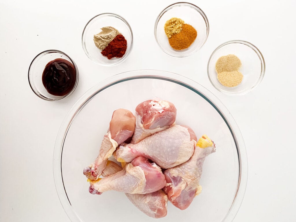 slow cooker barbecue drumsticks ingredients in glass bowls