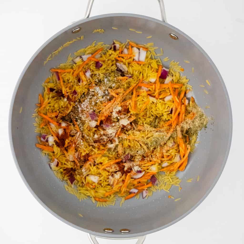 veggies and orzo in skillet