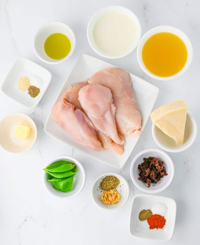 Slow cooker marry me chicken ingredients on countertop in bowls