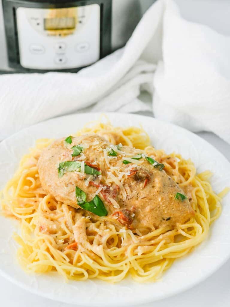 Slow cooker marry me chicken on white plate