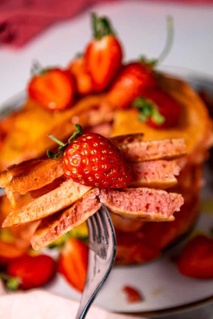 fork full of strawberry pancakes