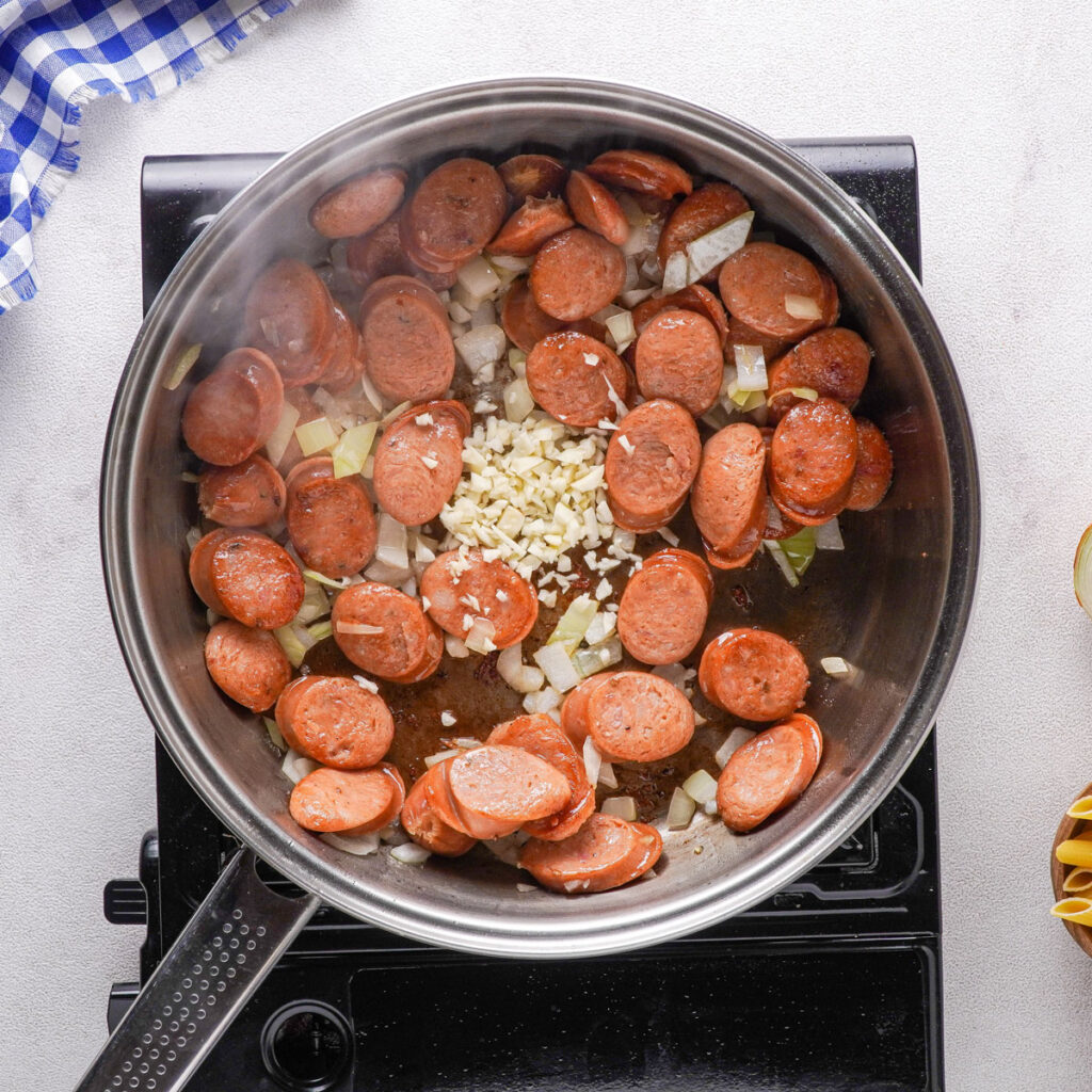 sliced sausages in skillet
