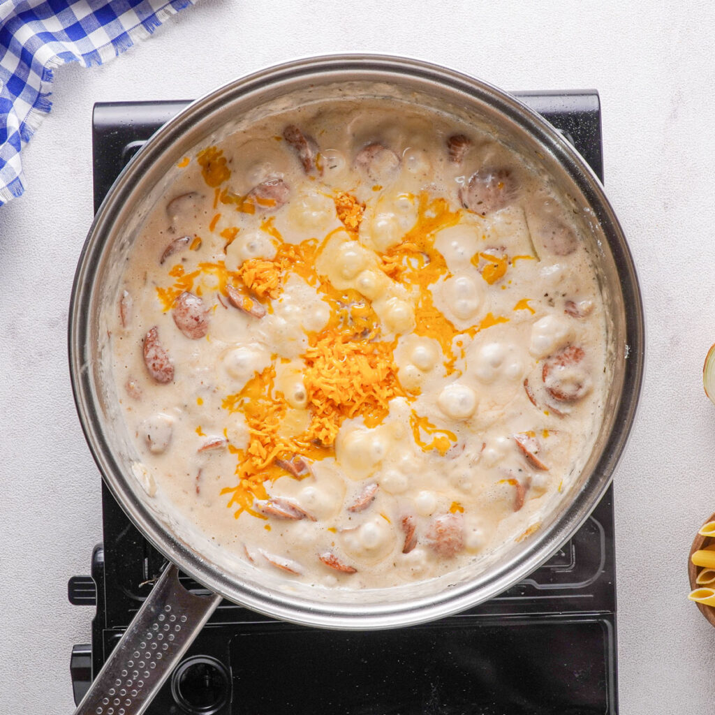cheesy kielbasa pasta in skillet
