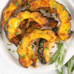 roasted acorn squash slices on plate