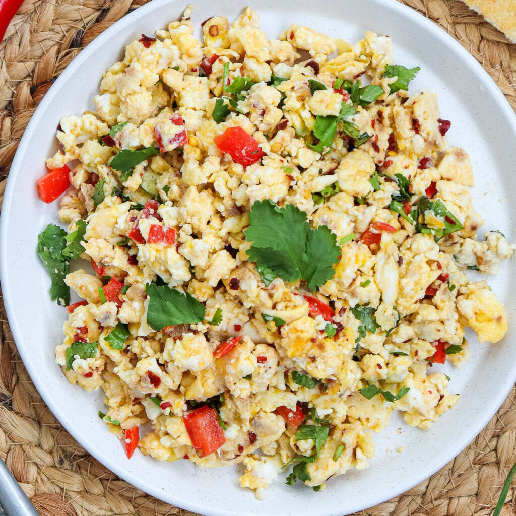 white plate with fiesta scrambled eggs