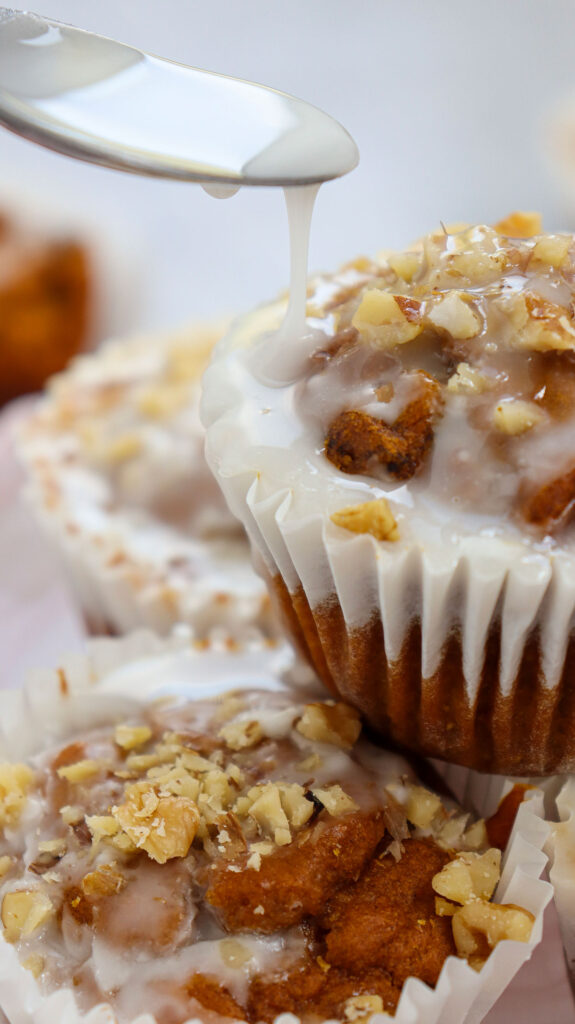 stack of glazed pumpkin muffins