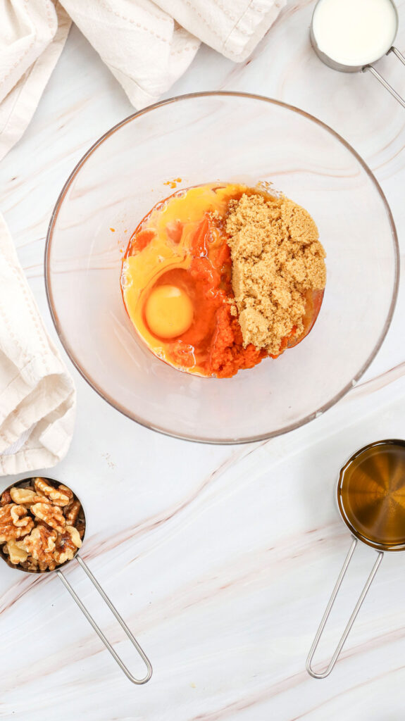 pumpkin muffins ingredients in glass bowl