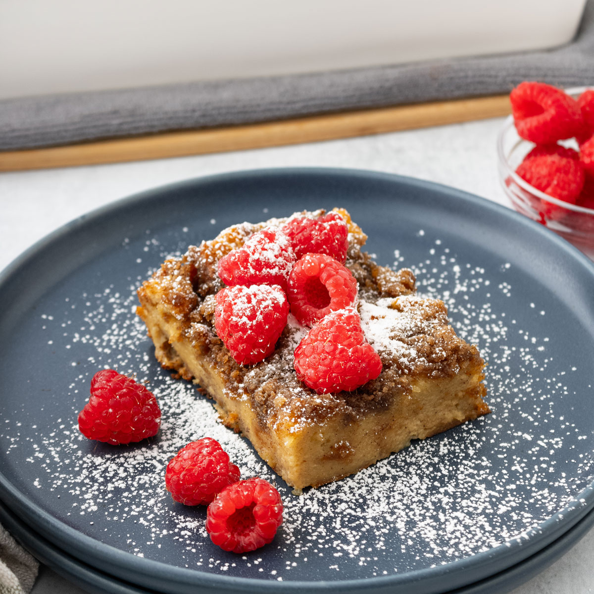 French toast casserole piece on grey plate