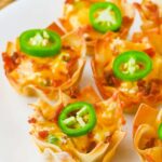 collage of Jalapeño popper wonton cups with recipe name overlay