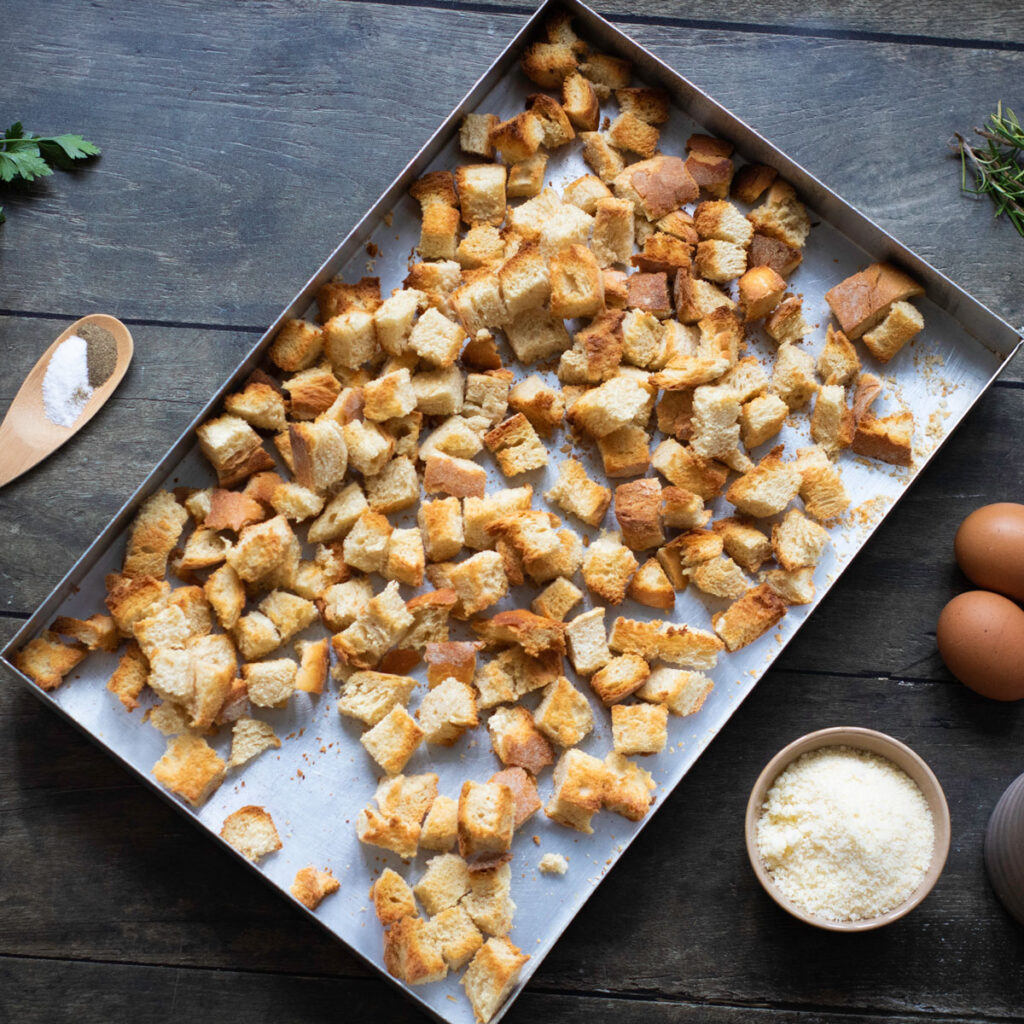 bread cubes on baking sheet