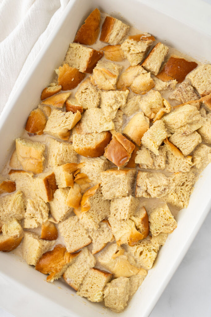 cubes of brioche in a casserole dish