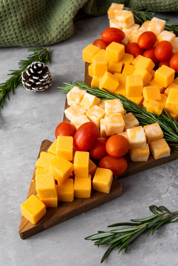 Christmas tree cheese platter with rosemary sprigs
