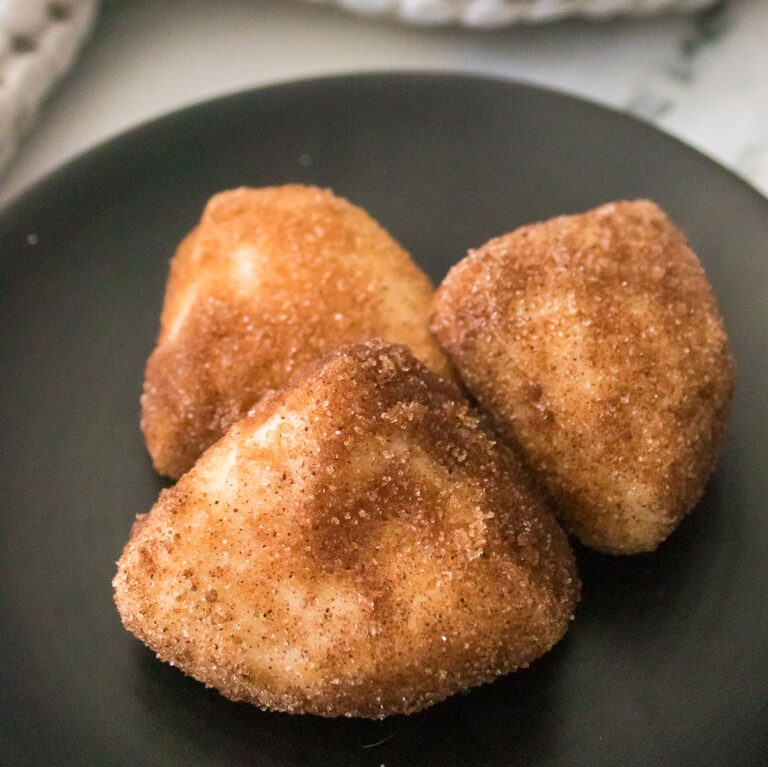 Cinnamon Sugar Biscuit Bites on black plate