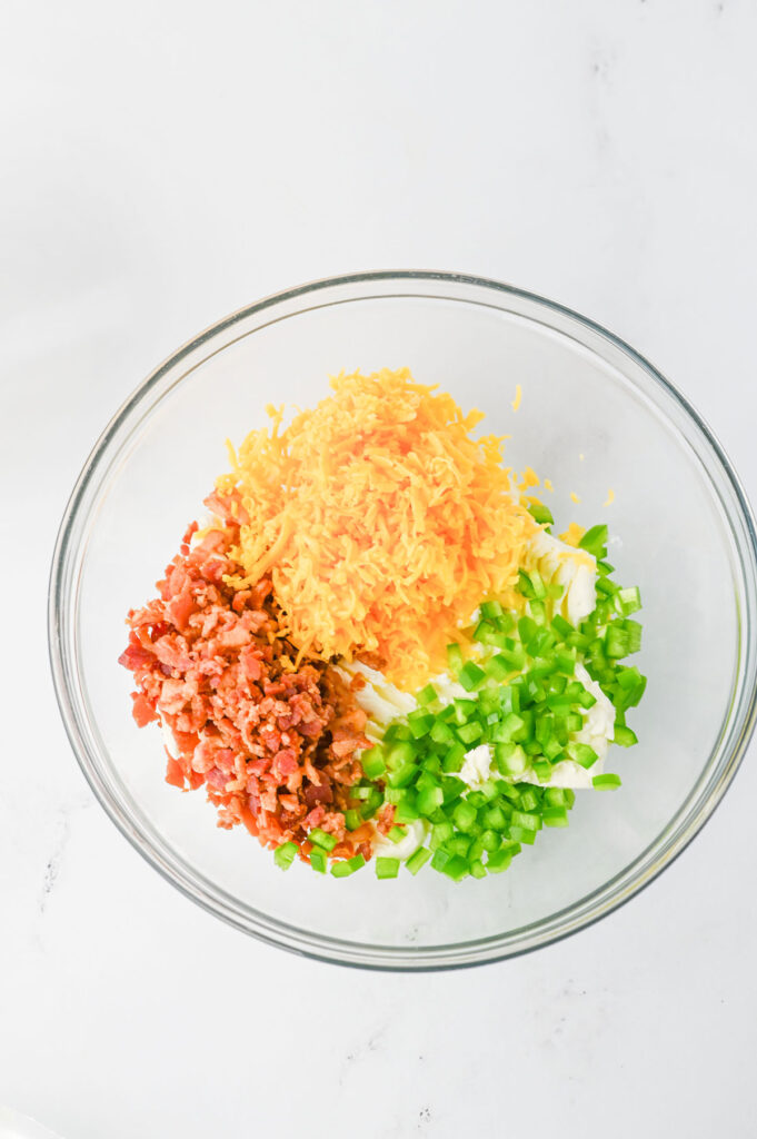 jalapeño popper filling ingredients in glass bowl