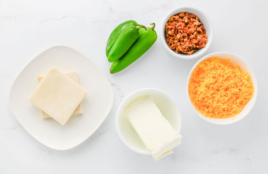 jalapeño popper wontons ingredients in white bowls on counter