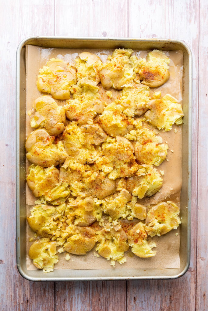 smashed potatoes on baking sheet before baking