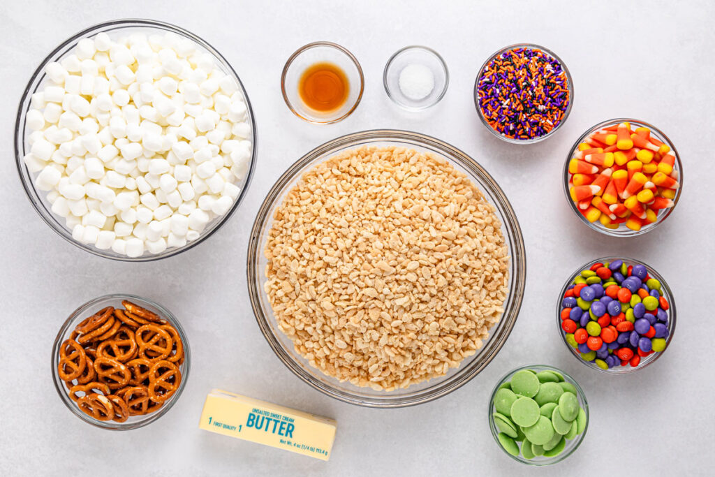 Halloween rice krispie treats ingredients in bowls on counter