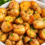 close up of bowl of crispy roasted potatoes