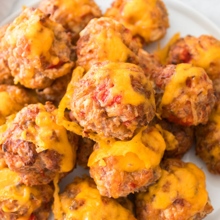 cream cheese sausage balls stacked on plate