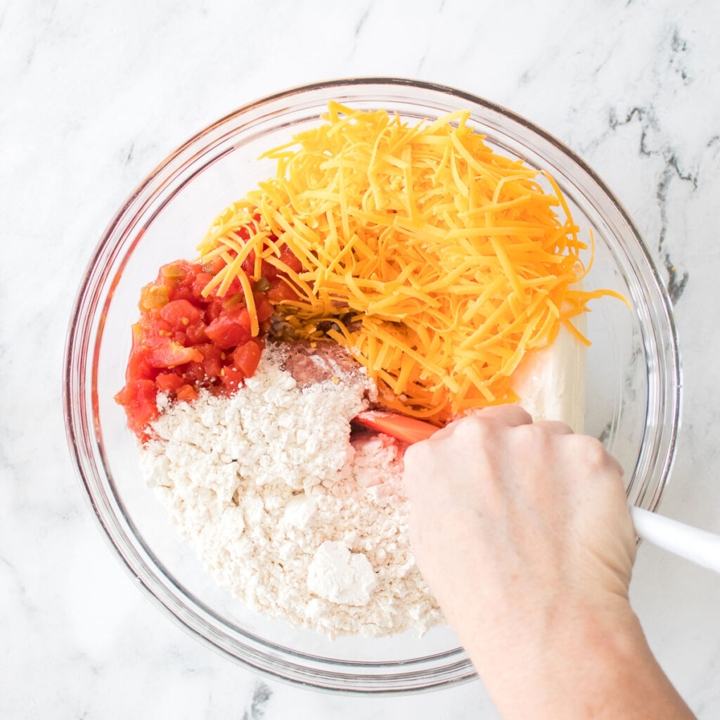 mixing ingredients to make rotel sausage balls