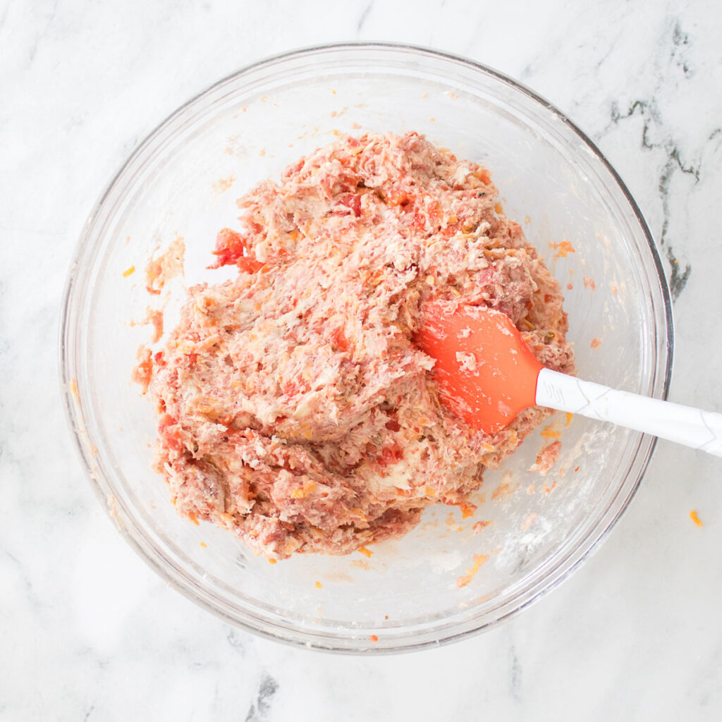 stirring ingredients for rotel sausage balls together