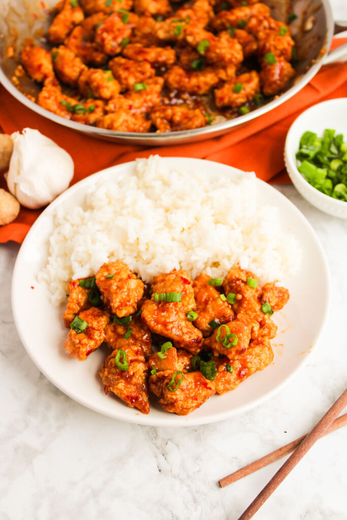 general tsos chicken and rice on plate