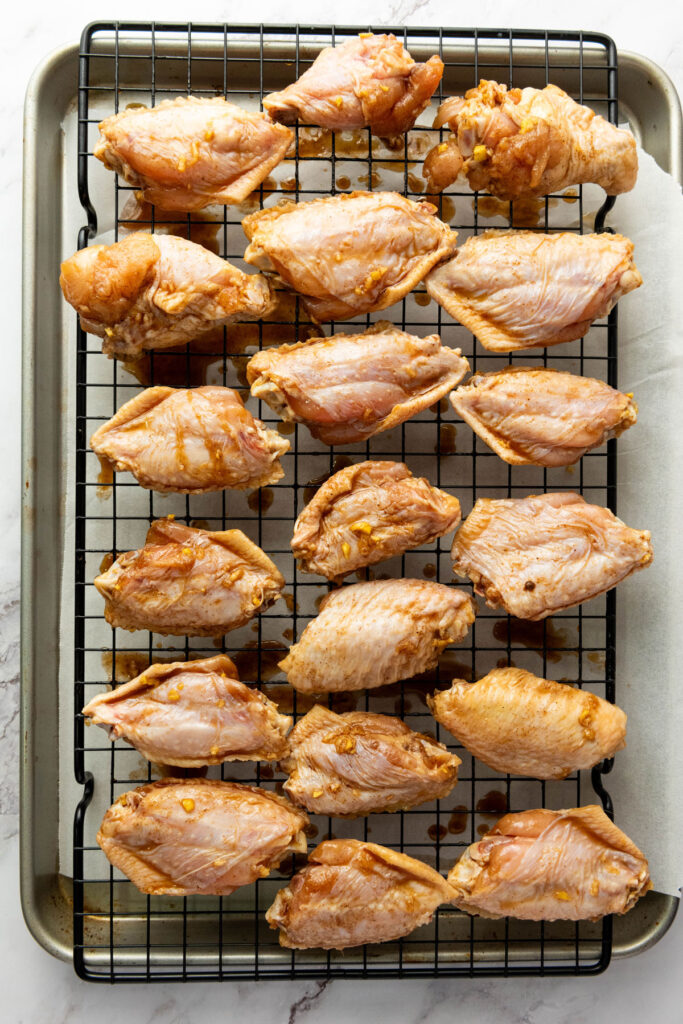 asian sticky wings before baking on wire rack