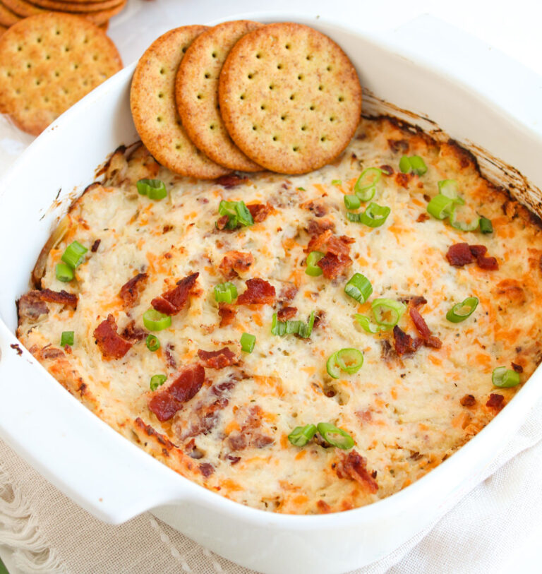 crack chicken dip with crackers on top