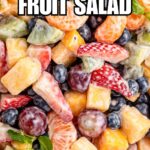close up of creamy fruit salad with recipe name overlay
