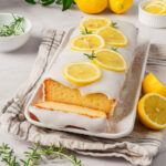 lemon loaf cake with one slice removed
