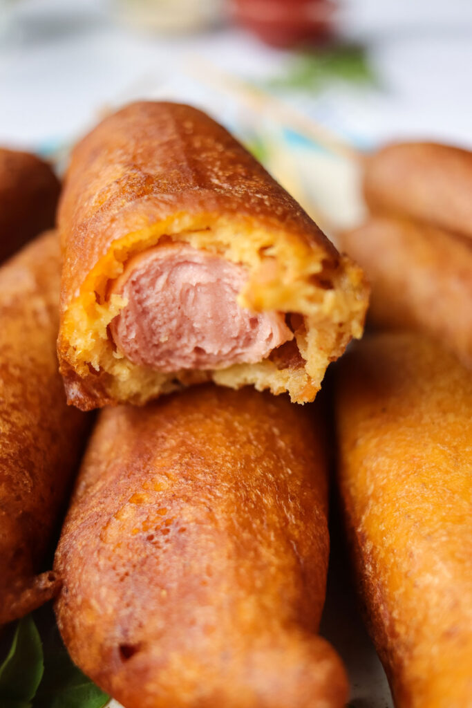homemade corndogs with one bitten into