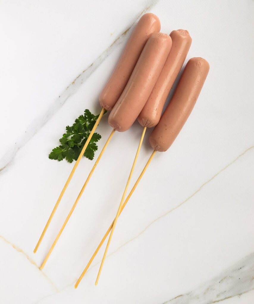 hot dogs on skewers for making homemade corndogs