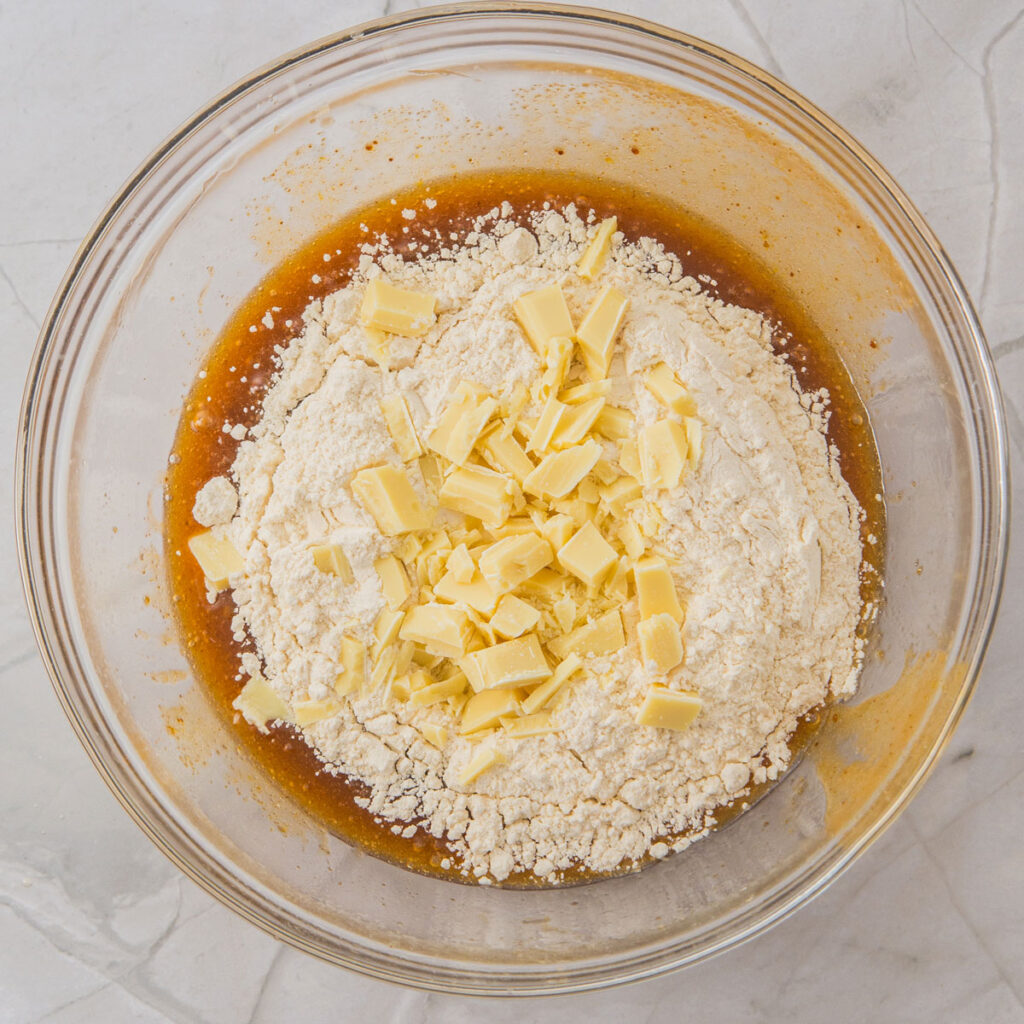 White Chocolate Raspberry Cookies batter being mixed in glass bowl