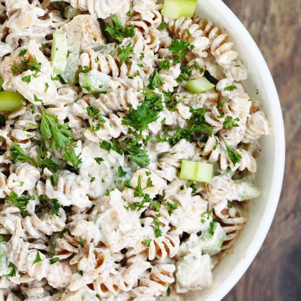 creamy chicken pasta salad in white bowl