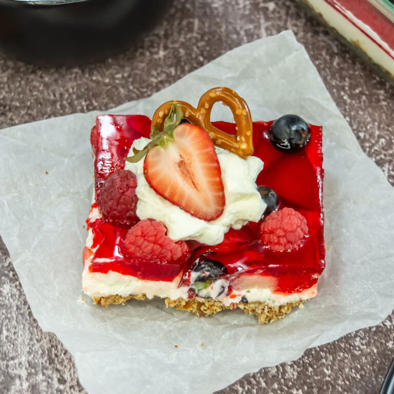 slice of pretzel berry salad on parchment paper