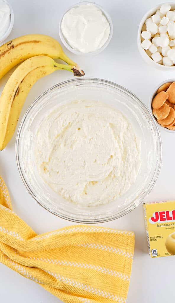 whipped cream and pudding mixed in bowl to make banana pudding fluff salad