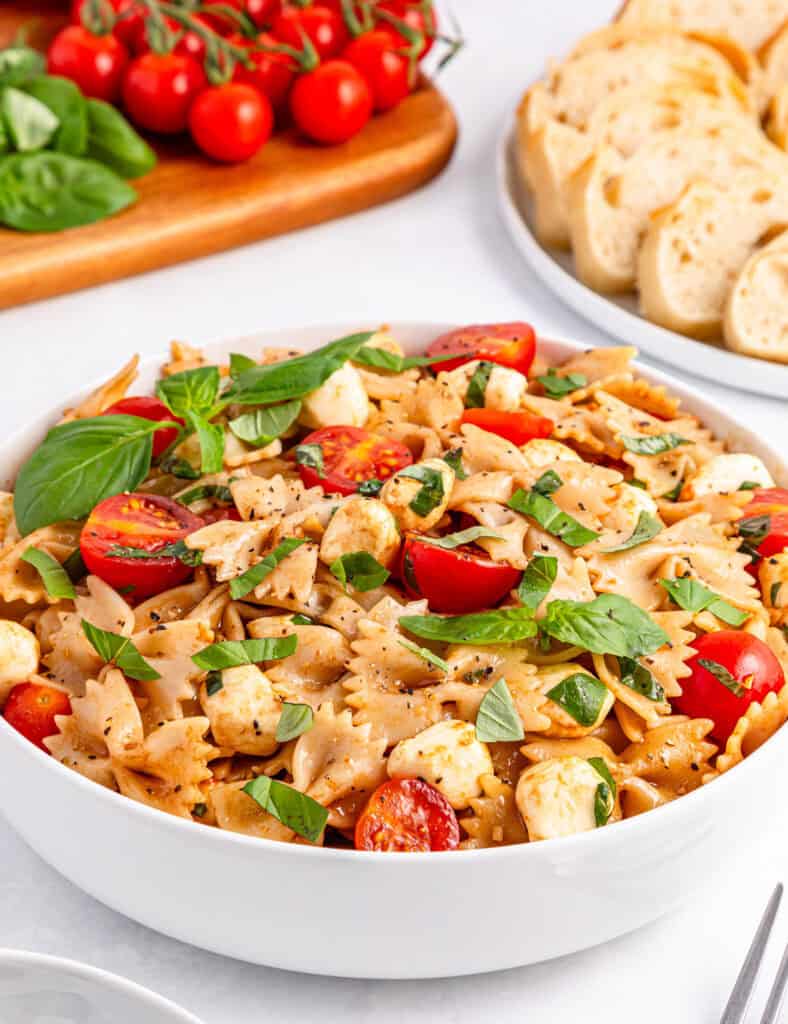 caprese pasta salad in white bowl