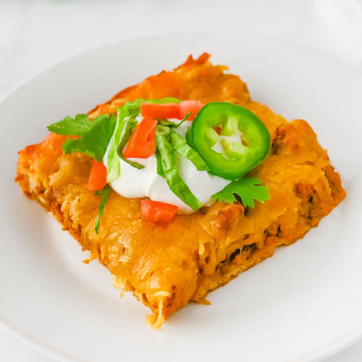 portion of crescent taco bake on white plate